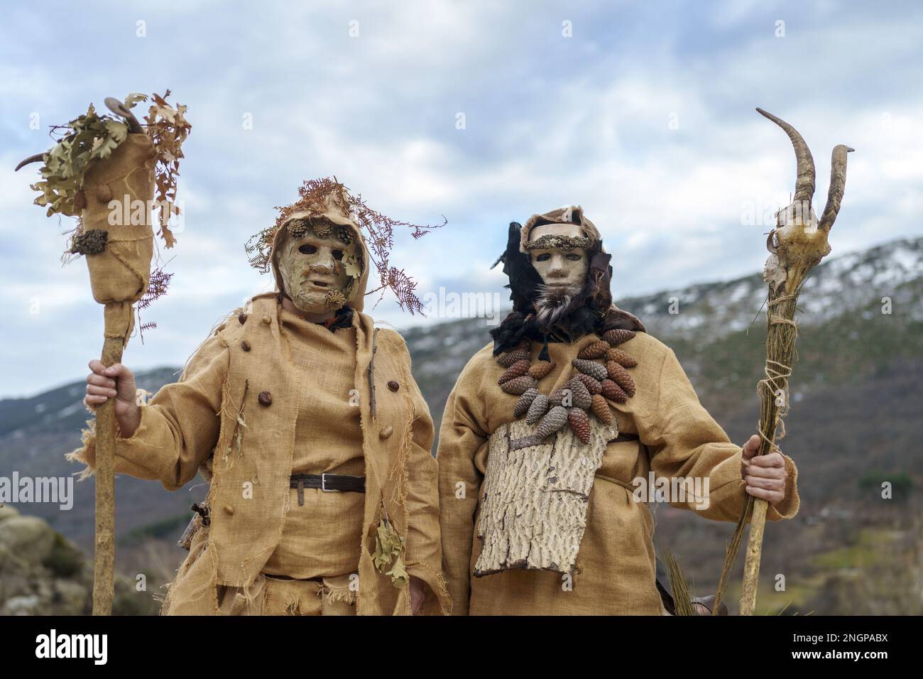 Navalacruz, Spain. 18th Feb, 2023. Carnival revellers dressed as traditional 'Harramacho' wearing leaves and other agricultural decor pose during a carnival festival in the village of Navalacruz, Spain, on Saturday, February 18, 2023. The 'Herramacho' figures, whose costumes are made from natural materials collected from the surrounding environment, were believed to protect family and cattle in pre-Roman rituals. Photo by Paul Hanna/UPI Credit: UPI/Alamy Live News Stock Photo