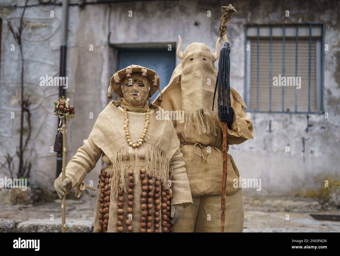 Navalacruz, Spain. 18th Feb, 2023. Carnival revellers dressed as traditional 'Harramacho' wearing agricultural decor pose during a carnival festival in the village of Navalacruz, Spain, on Saturday, February 18, 2023. The 'Herramacho' figures, whose costumes are made from natural materials collected from the surrounding environment, were believed to protect family and cattle in pre-Roman rituals. Photo by Paul Hanna/UPI Credit: UPI/Alamy Live News Stock Photo