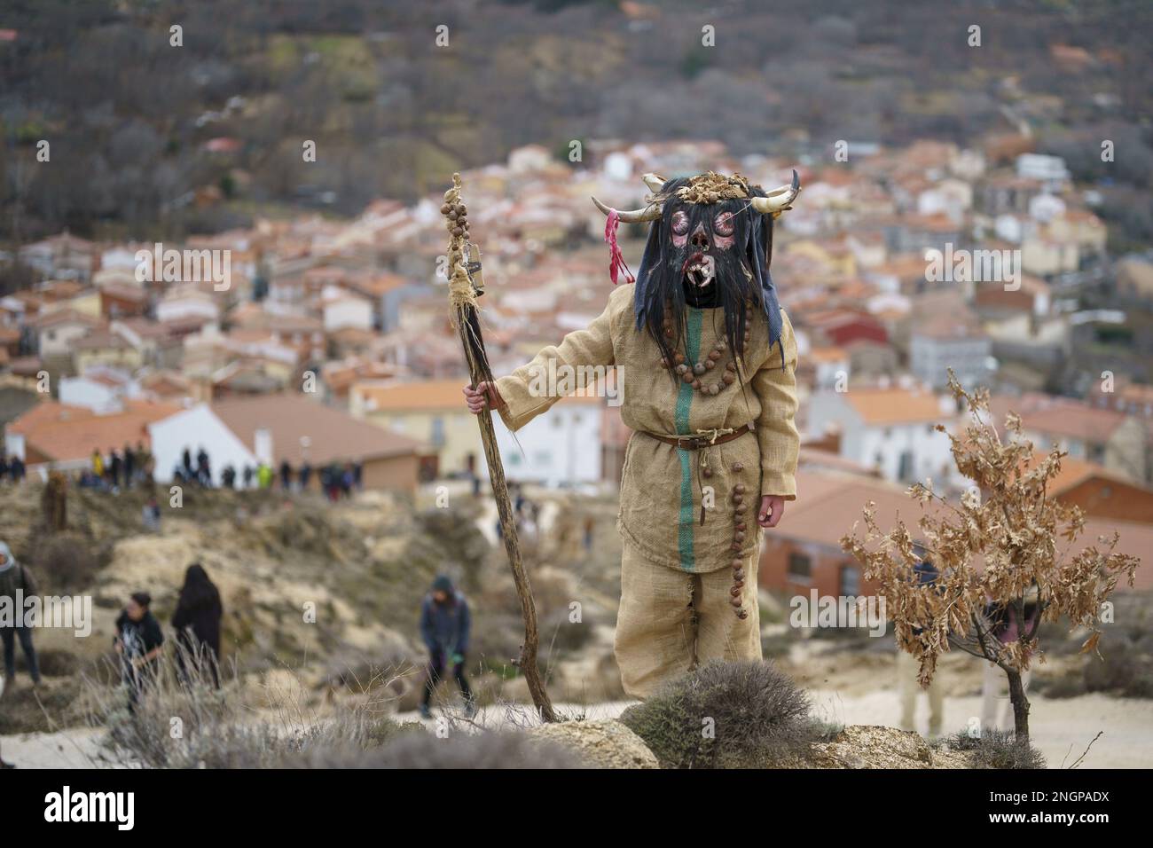 Navalacruz, Spain. 18th Feb, 2023. A carnival reveller dressed as a traditional 'Harramacho' wearing animal horns and other natural decor takes part in a carnival festival in the village of Navalacruz, Spain, on Saturday, February 18, 2023. The 'Herramacho' figures, whose costumes are made from natural materials collected from the surrounding environment, were believed to protect family and cattle in pre-Roman rituals. Photo by Paul Hanna/UPI Credit: UPI/Alamy Live News Stock Photo