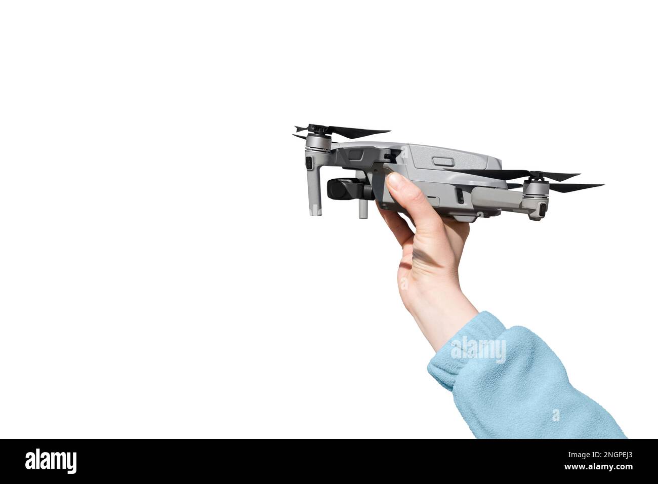 Hand holding drone ready to take off isolated on the whire background