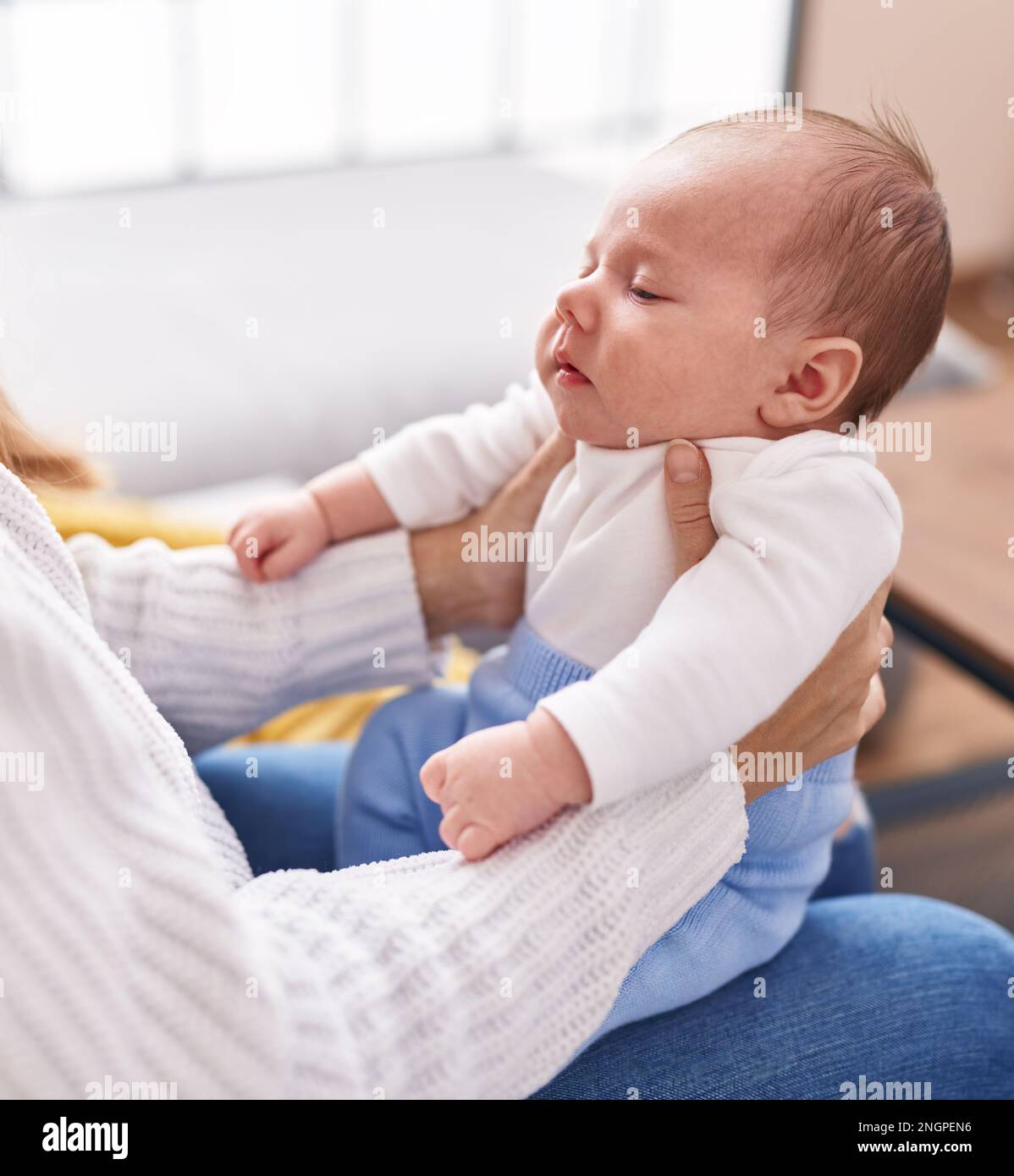 Young mother sleeping on sofa hi-res stock photography and images - Alamy