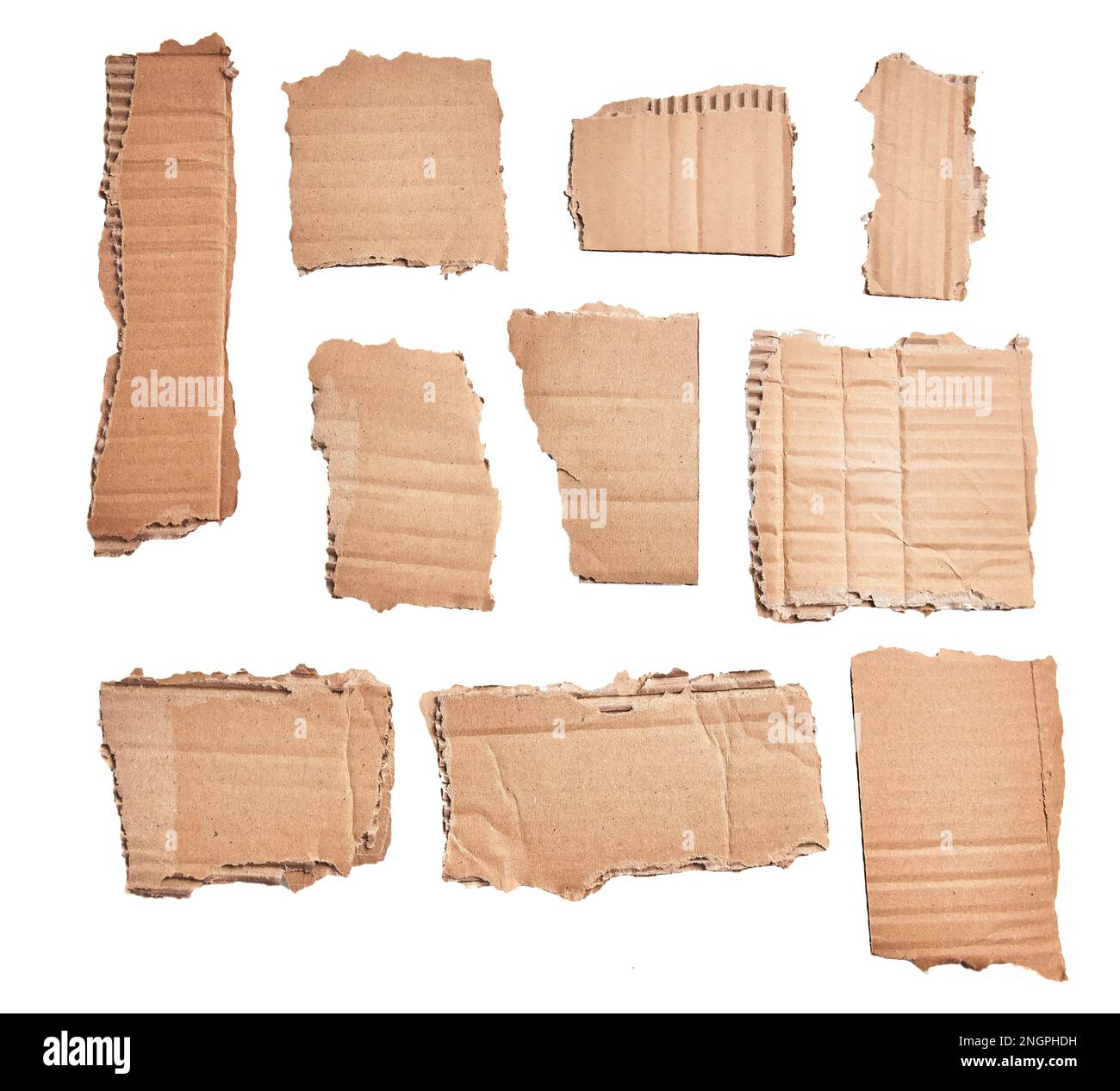 Ripped pieces of cardboard material over isolated white background ...