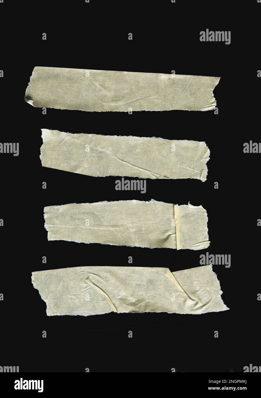 Set of pieces of general purpose paper yellow tape isolated on black