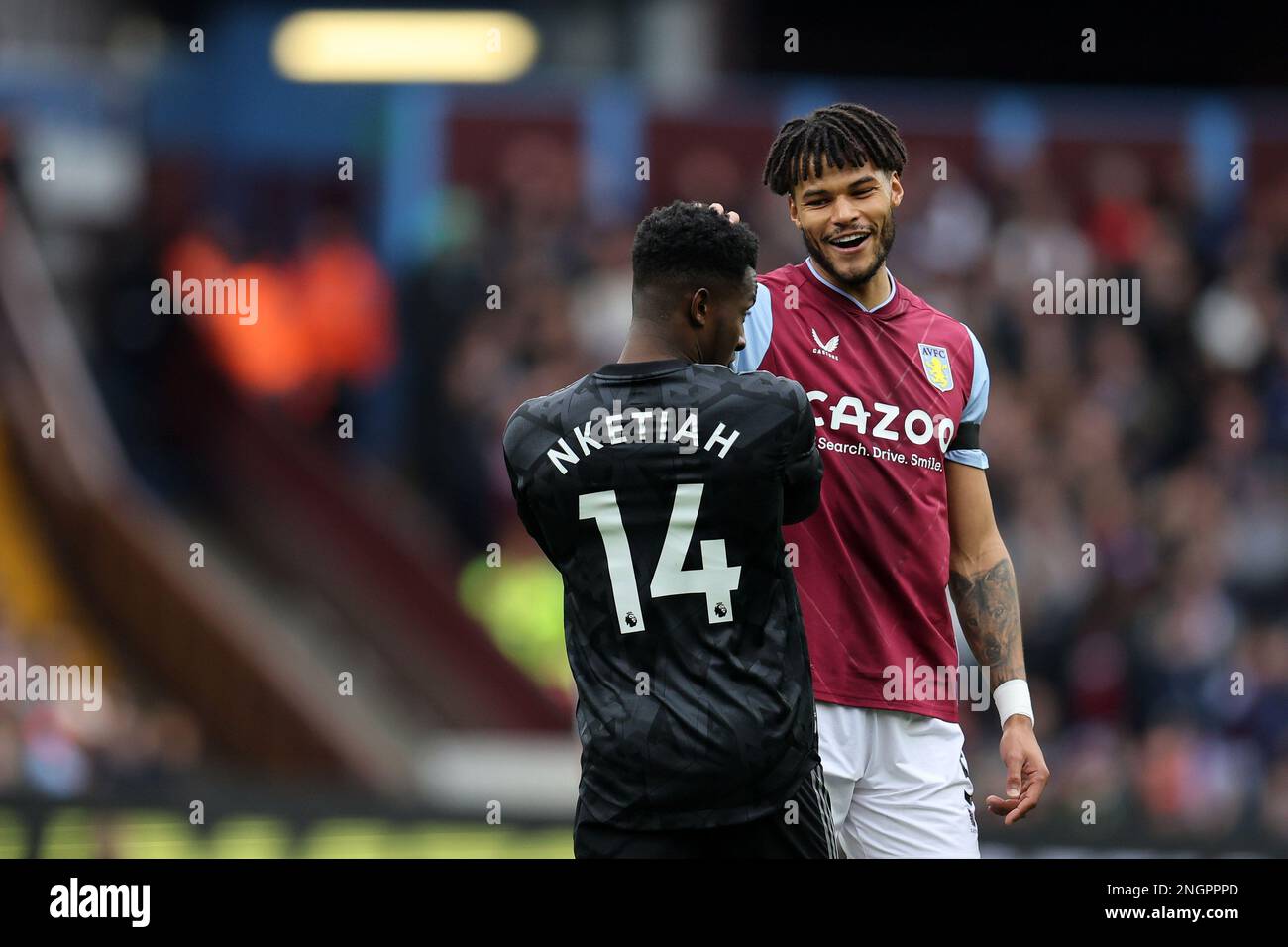 Birmingham, UK. 18th Feb, 2023. Tyrone Mings of Aston Villa jokes with Eddie Nketiah of Arsenal. Premier League match, Aston Villa v Arsenal at Villa Park in Birmingham on Saturday 18th February 2023. this image may only be used for Editorial purposes. Editorial use only, license required for commercial use. No use in betting, games or a single club/league/player publications. pic by Andrew Orchard/Andrew Orchard sports photography/Alamy Live news Credit: Andrew Orchard sports photography/Alamy Live News Stock Photo