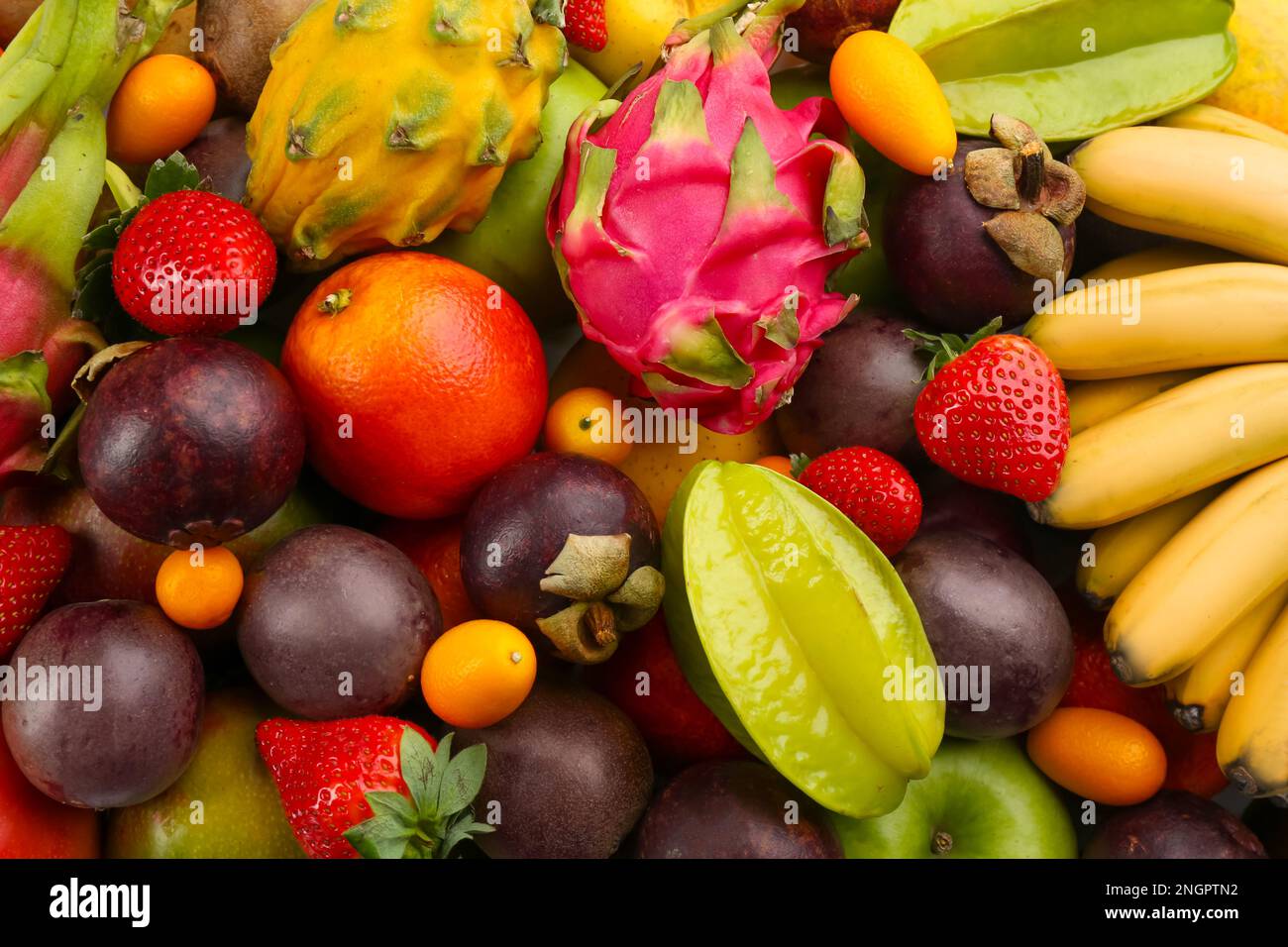 Assortment of fresh exotic fruits as background, top view Stock Photo