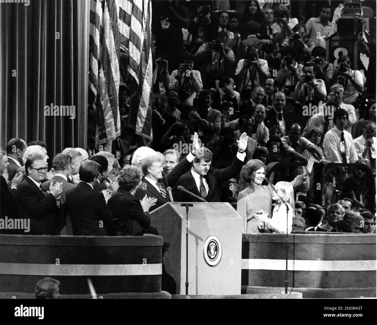 New York, NY - (FILE) -- United States President Jimmy Carter, U.S. Senator Edward M. 'Ted' Kennedy (Democrat of Massachusetts), first lady Roslyn Carter, and Amy Carter, join a host of Democratic Party officials on the podium on the last night of the 1980 Democratic National Convention in New York, New York on Thursday, August 14, 1980 in a show of unity after a bruising battle for the party's nomination for President.Credit: Arnie Sachs/CNP Stock Photo