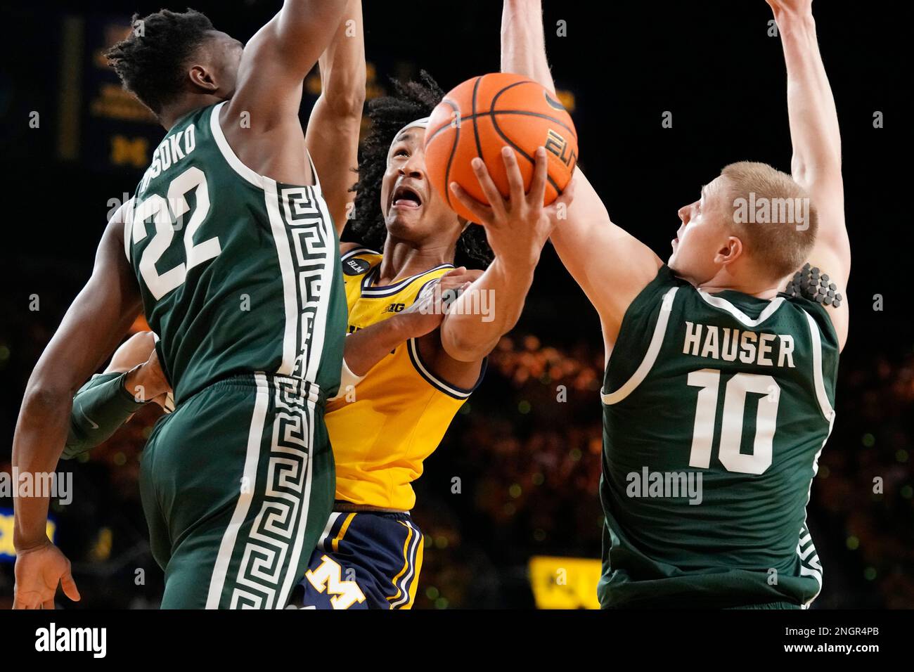 Michigan Guard Kobe Bufkin Attempts A Layup As Michigan State Center michigan-guard-kobe-bufkin-attempts-a-layup-as-michigan-state-center