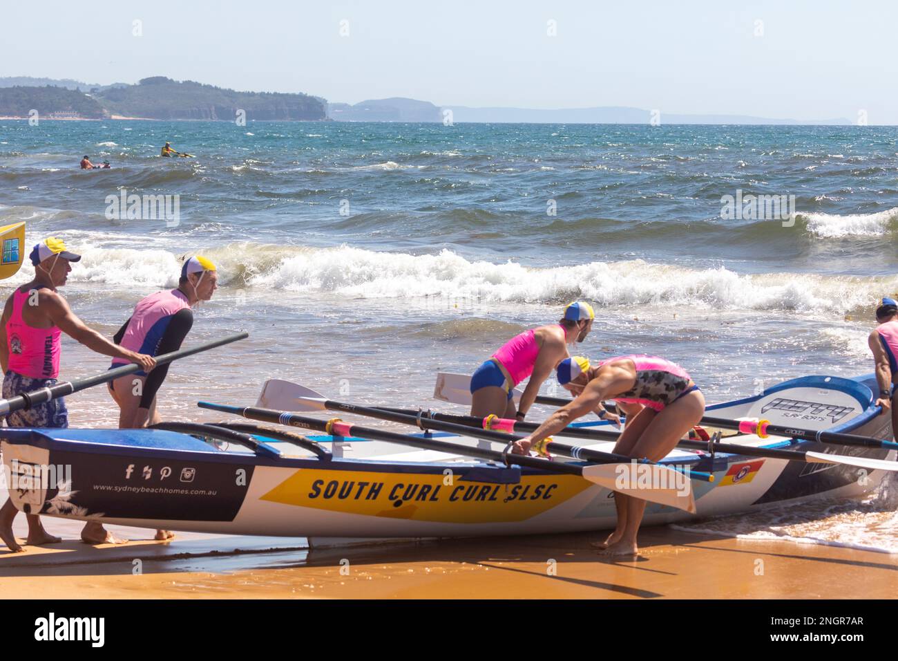 Traditional surfboat racing on Collaroy beach in Sydney, summer 2023, NSW,Australia Stock Photo