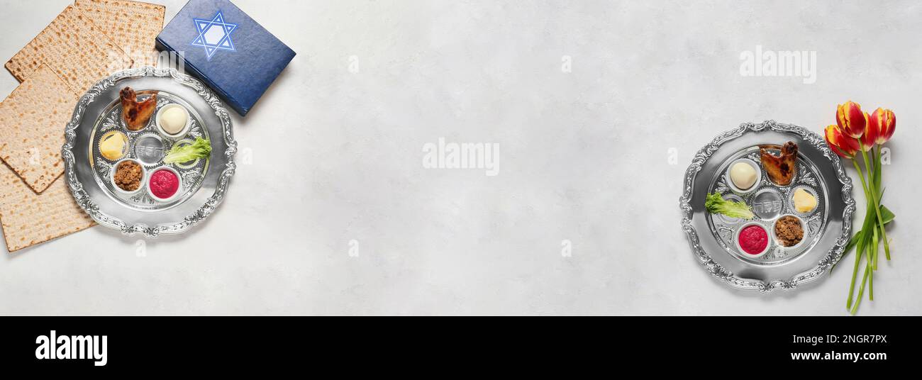 Banner with Passover Seder plates, flatbread matza, Torah and flowers