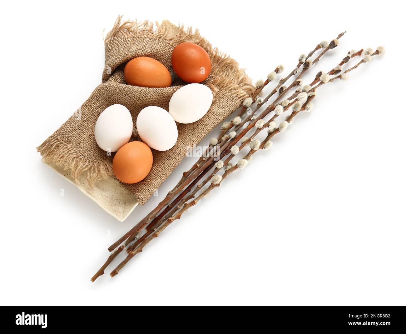 Plate with Easter eggs and willow branches on white background Stock ...