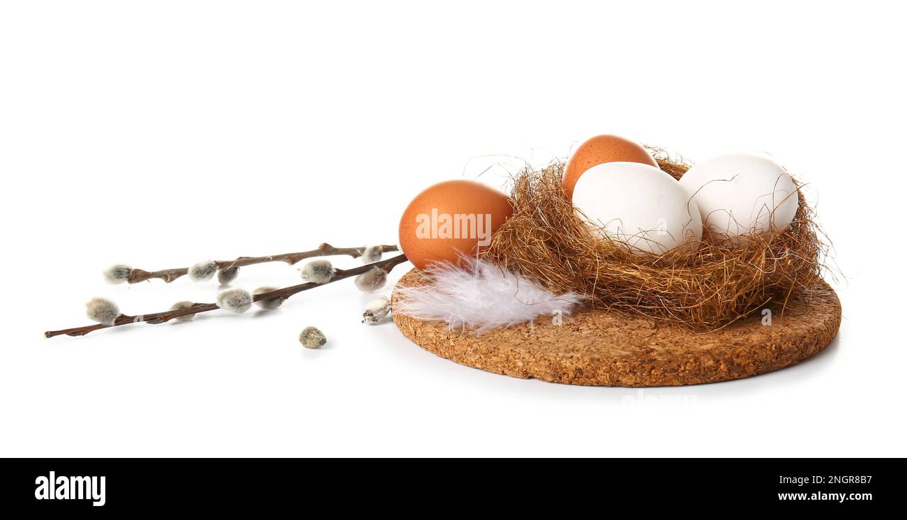 Nest with Easter eggs and willow branches on white background Stock ...
