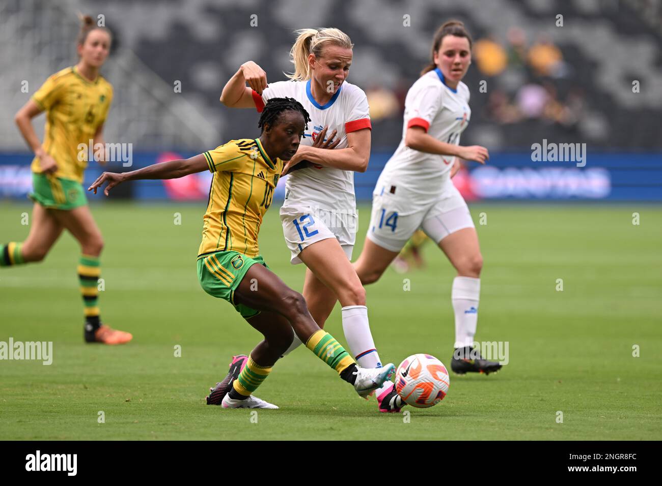 Trudi Carter of Jamaica comes under pressure from the Czechia defence ...