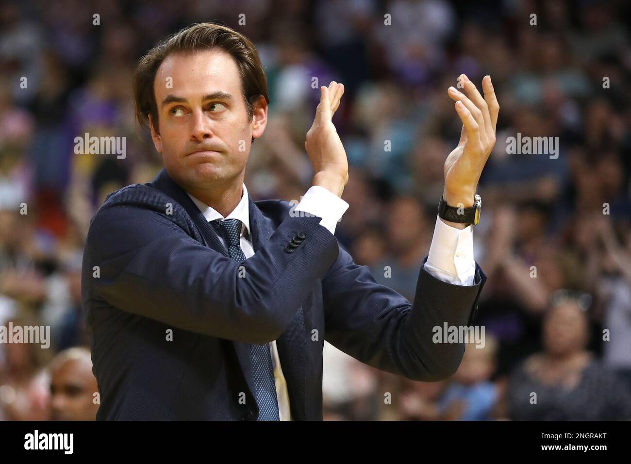 Coach of the Kings Chase Buford embraces the crowd after winning the