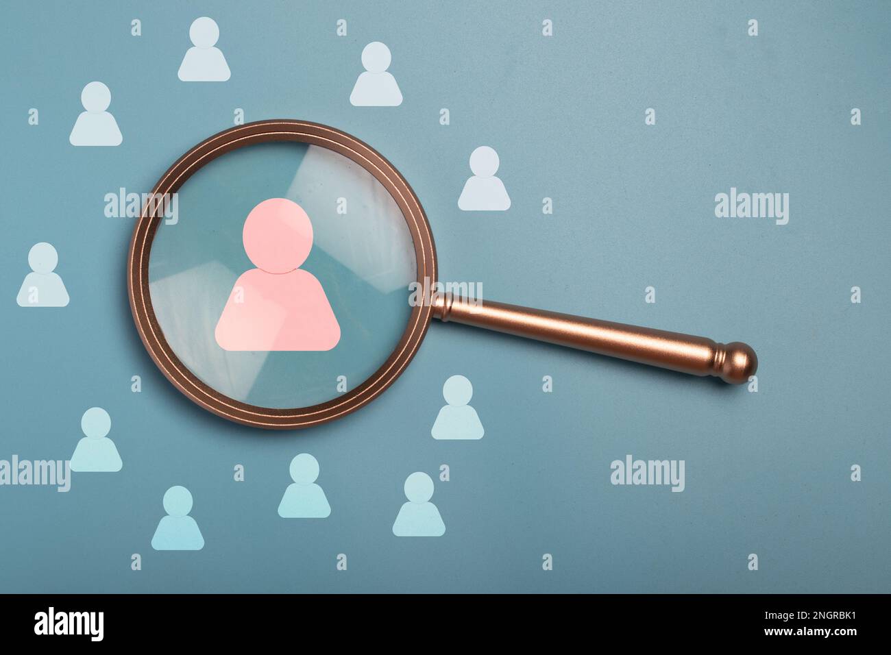 HRM or Human Resource Management, Magnifier glass focus to manager icon which is among staff icons for human development recruitment leadership Stock Photo