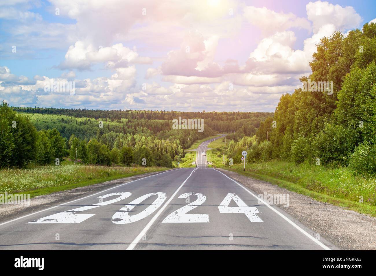 2024 written on highway road in the middle of empty asphalt road Stock