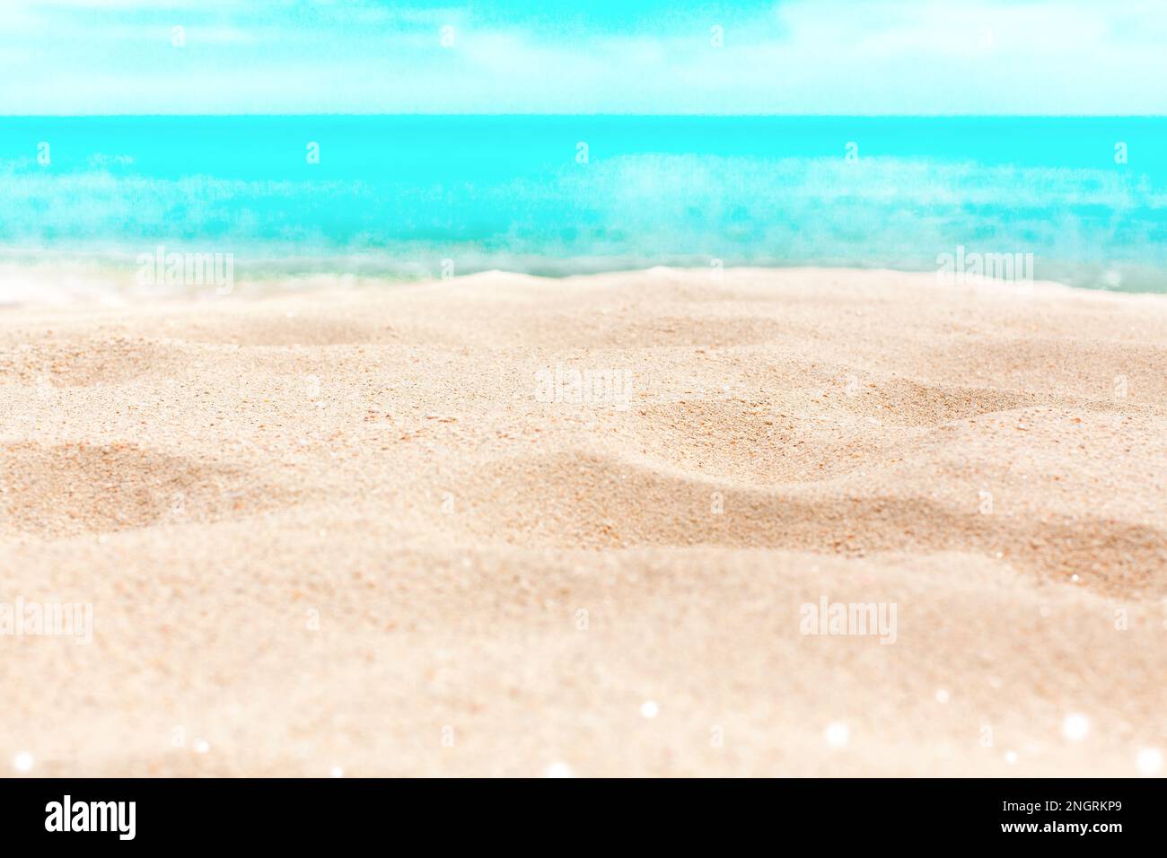 Tropical island beach nature blurred bokeh background, yellow sand, blue sea water, turquoise ocean, sunny sky white clouds, summer holidays, vacation Stock Photo