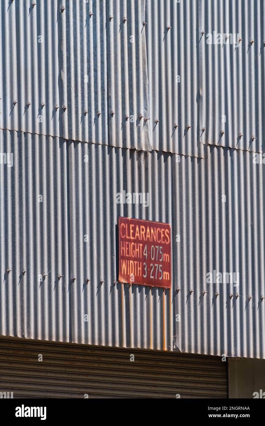 Metal corrugated iron factory wall and vintage signage in Castlemaine Australia. Stock Photo