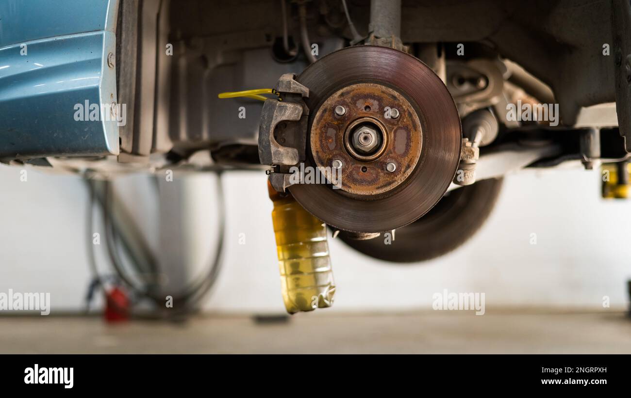 Automatic change of brake fluid in a car service Stock Photo Alamy