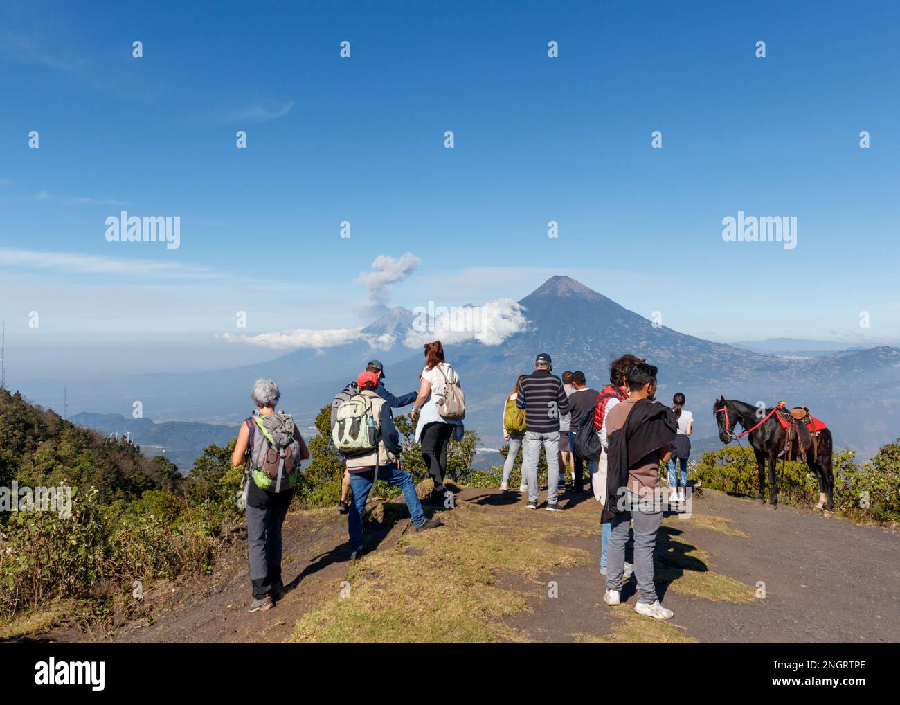 Top of Pacaya Volcano, group of tourist hiker enjoying freedom view of