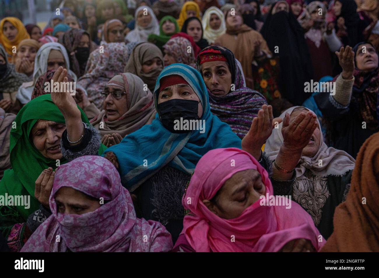 Kashmiri Muslim women pray as they wait for head priest to displays a ...