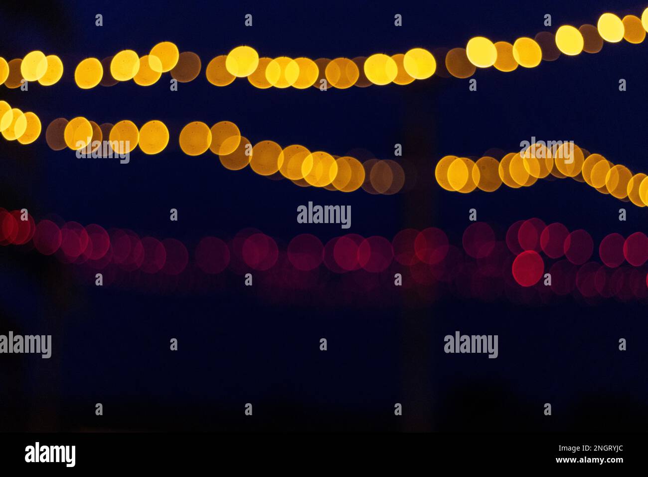 Blurred red, orange and yellow festive lights in the background Stock