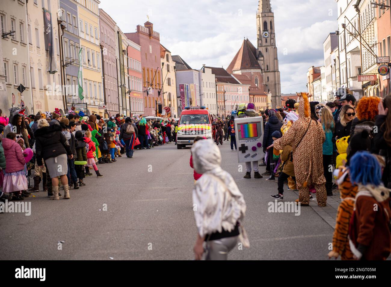 Neuoetting,Germany-February 18,2023:A fire department van clears the street for the incoming fasching parade Stock Photo