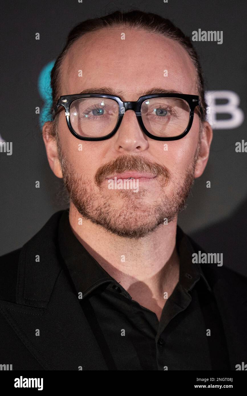 Tim Minchin poses for photographers upon arrival for the BAFTA Nominees