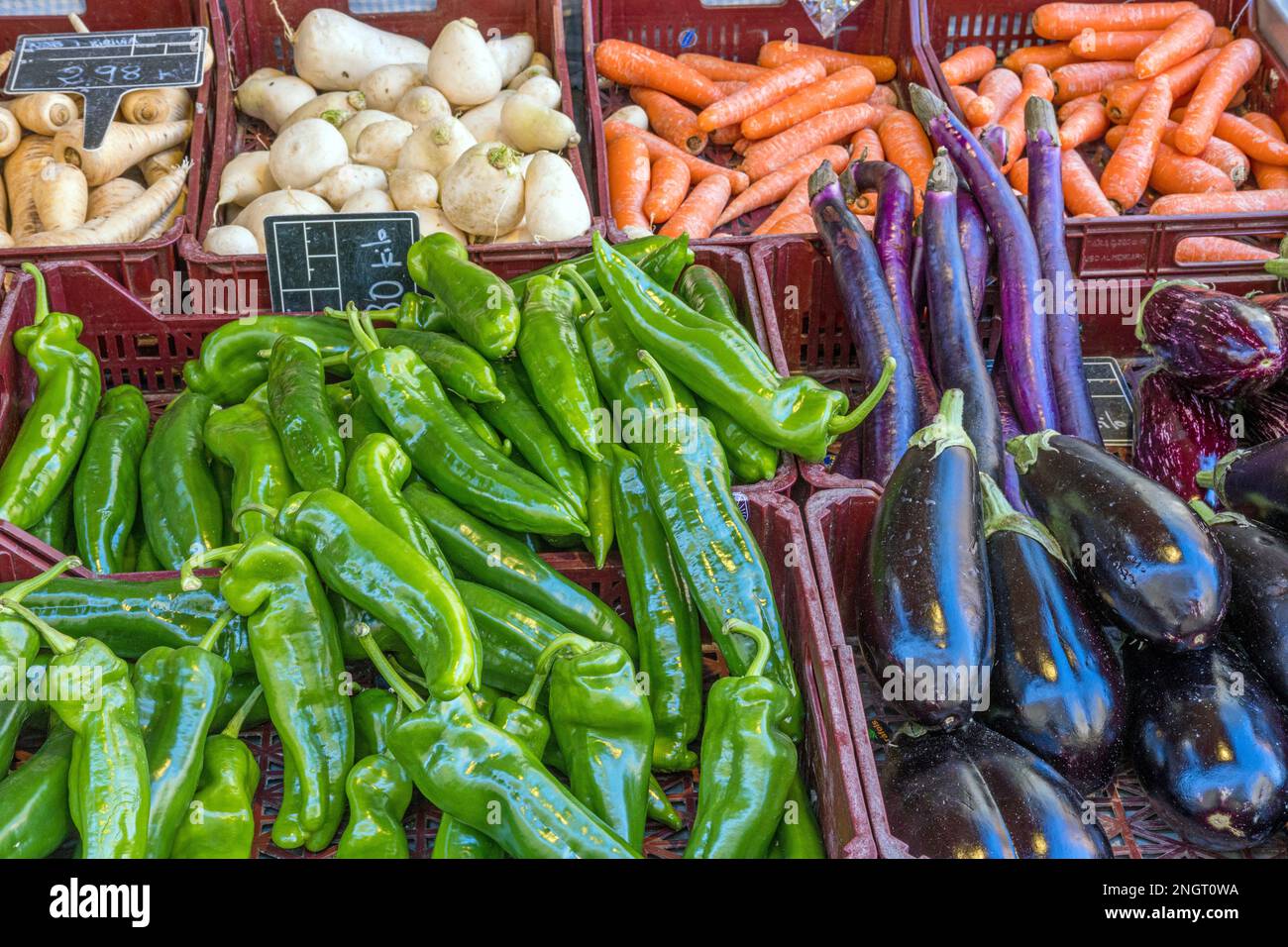 Peppers, eggplant and carrots for sale at a market Stock Photo - Alamy