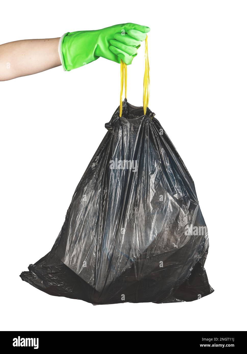 Hand in glove holding handles of black disposable garbage bag, trash