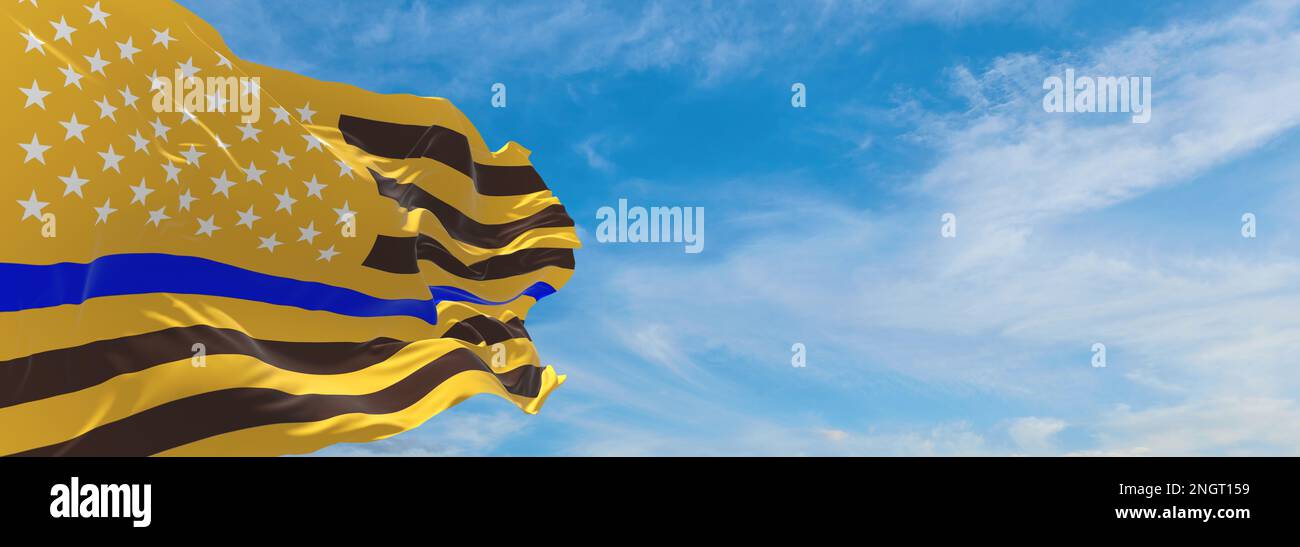 Thin Blue Line. Flag of USA Wyoming Gold Brown colors with Police Blue Line  waving in the wind on flagpole against the sky with clouds on sunny day  Stock Photo - Alamy