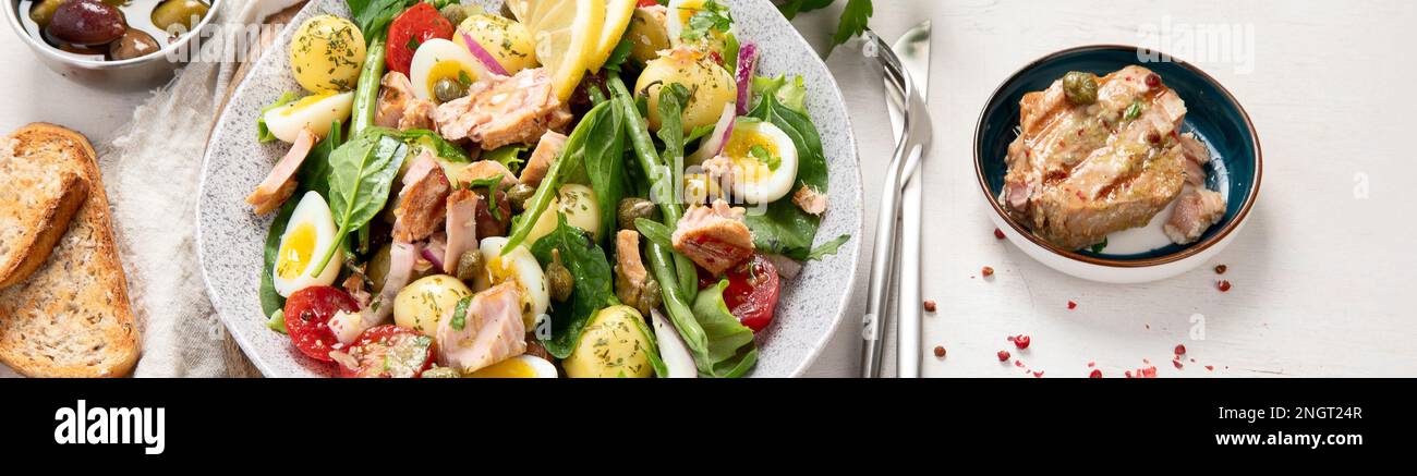 Nicoise salad with canned tuna. healthy mediterranen diet. Top view, panorama, banner Stock Photo