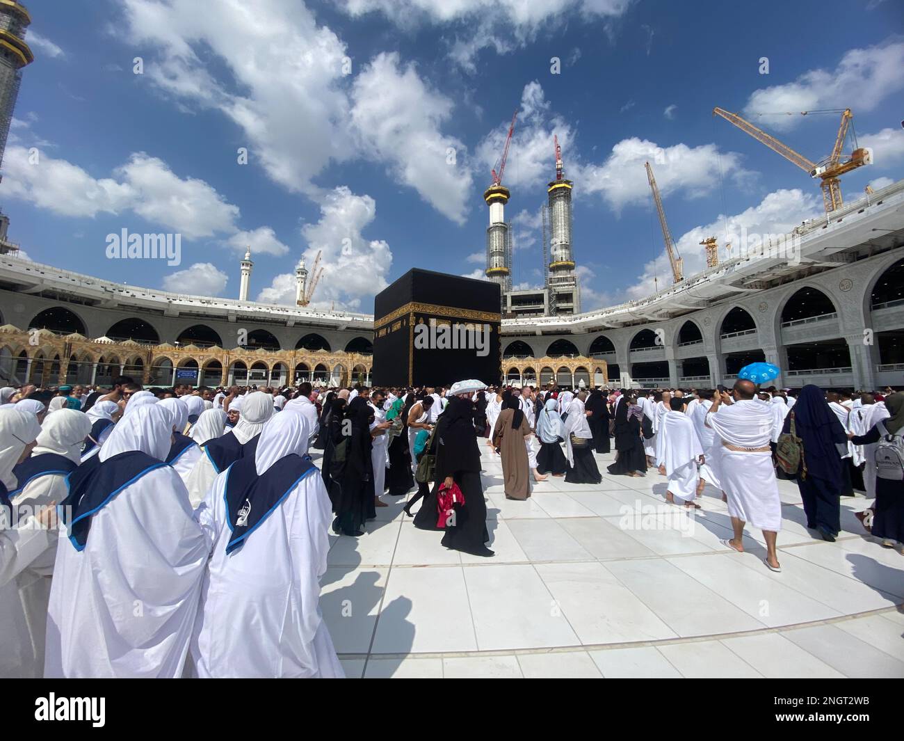 Muslim Pilgrims at The Kaaba in The Haram Mosque of Mecca , Saudi Arabia, In the morning performing umrah Stock Photo