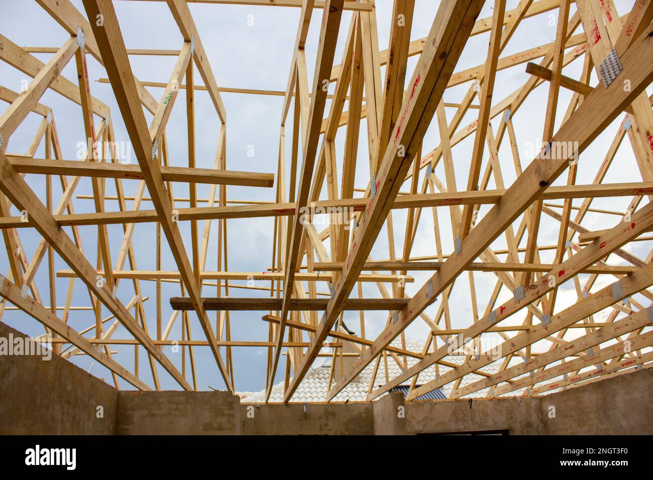 Wooden frame of a lattice of roof beams on a building under
