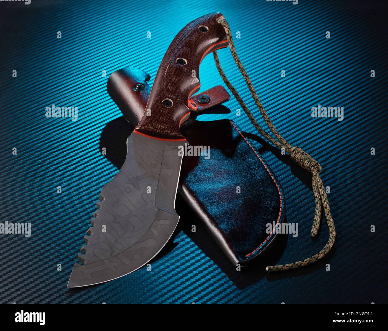 Bushcraft knife. Knife with saw and leather sheath. Blue illumination in the background
