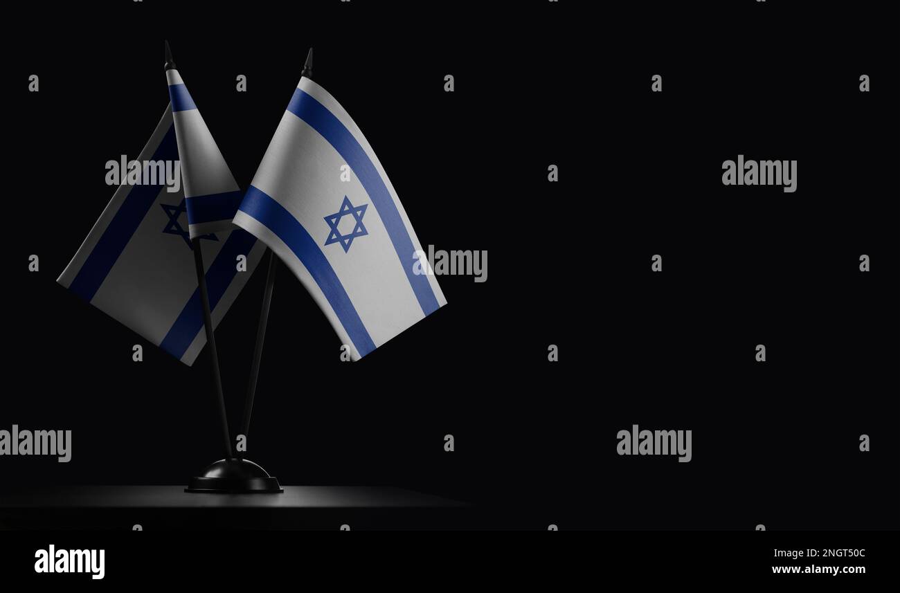 Small national flags of the Israel on a black background. Stock Photo