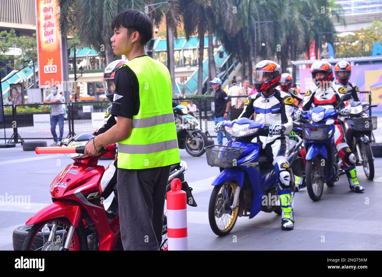 Young men take part in a motorcycling event, organised by Thailand's National Sports Development Fund (NSDF), at Central World shopping mall, Bangkok, Thailand, Asia on 19th February, 2023. Young male motorcyclists display safe use of a motorbike. Thailand's roads have the most  deaths in Southeast Asia with the ninth greatest rate of road fatalities in the world at 32.7 per 100,000 people each year, says the World Health Organization. Some 20,000 people die on Thailand's roads each year. Stock Photo