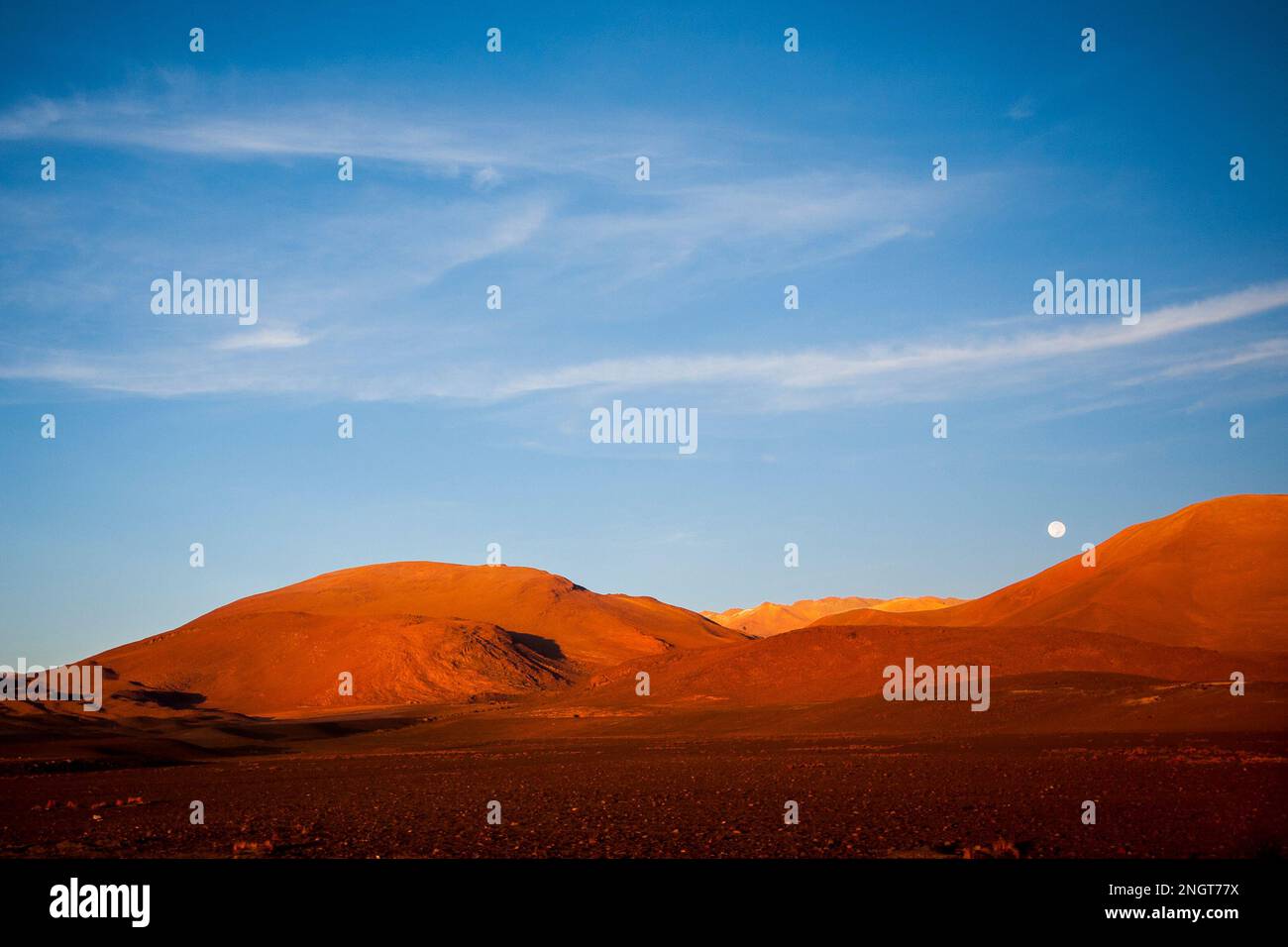 sunrise and moonset in altiplano bolivian mountains andes Stock Photo