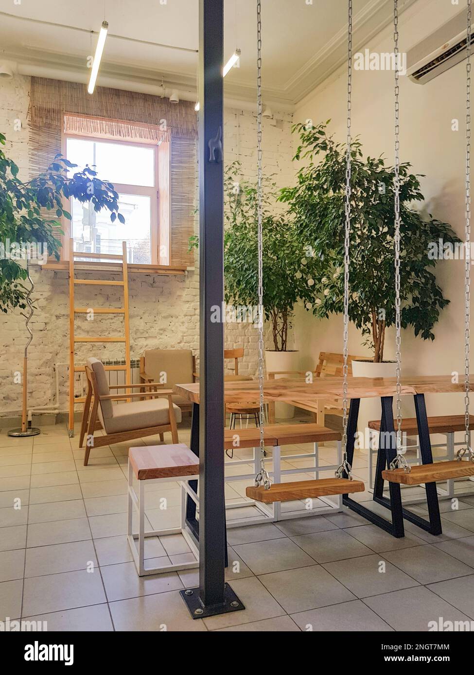 Cozy interior of a modern cafe in vintage style, with wooden tables and