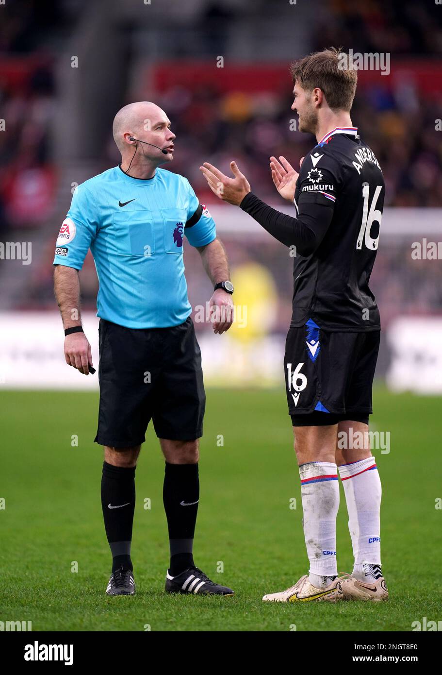 Referee Paul Tierney has words with Crystal Palace's Joachim Andersen, (right) during the Premier League match at the Gtech Community Stadium, London. Picture date: Saturday February 18, 2023. Stock Photo