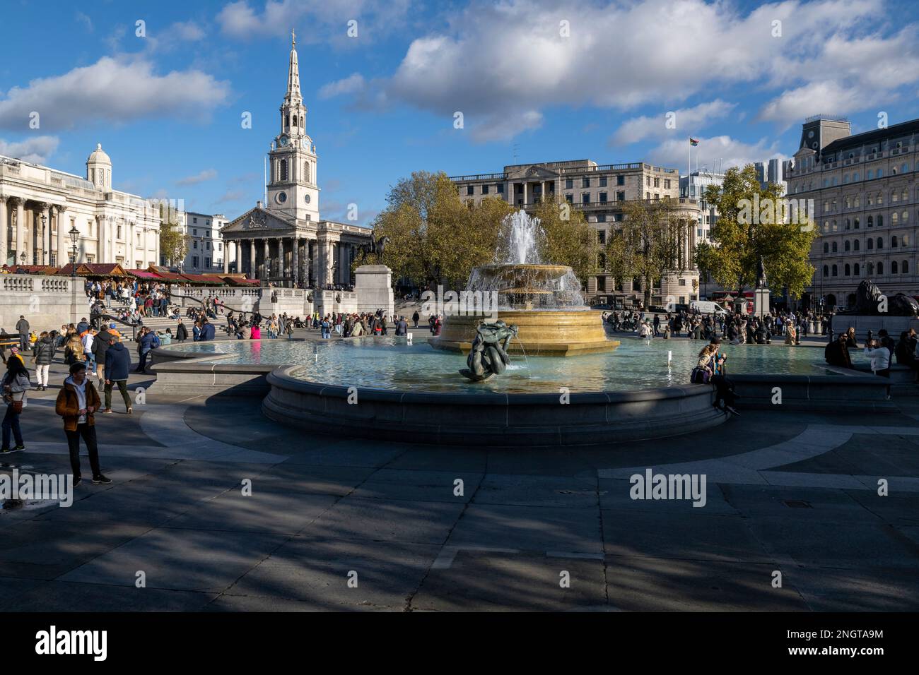 A view across Trafalgar Square looking east. Part of the National Gallery can be seen on the left as well as the church of Saint Martin-in the-Fields. Stock Photo
