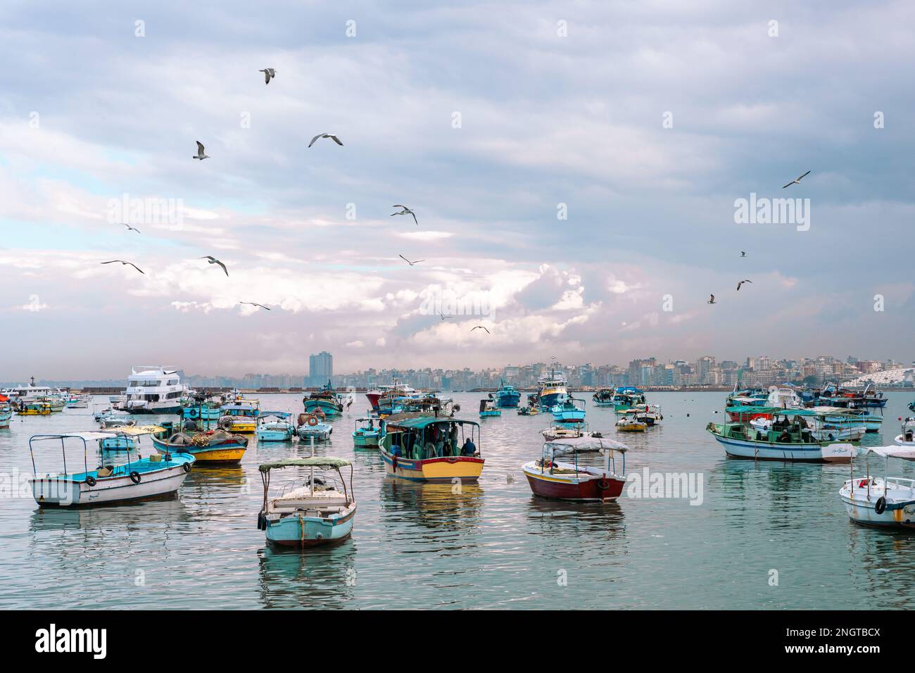 Harbor of Fishing Boats Floating on Blue Sea Water, Alexandria, Egypt. Africa. Stock Photo