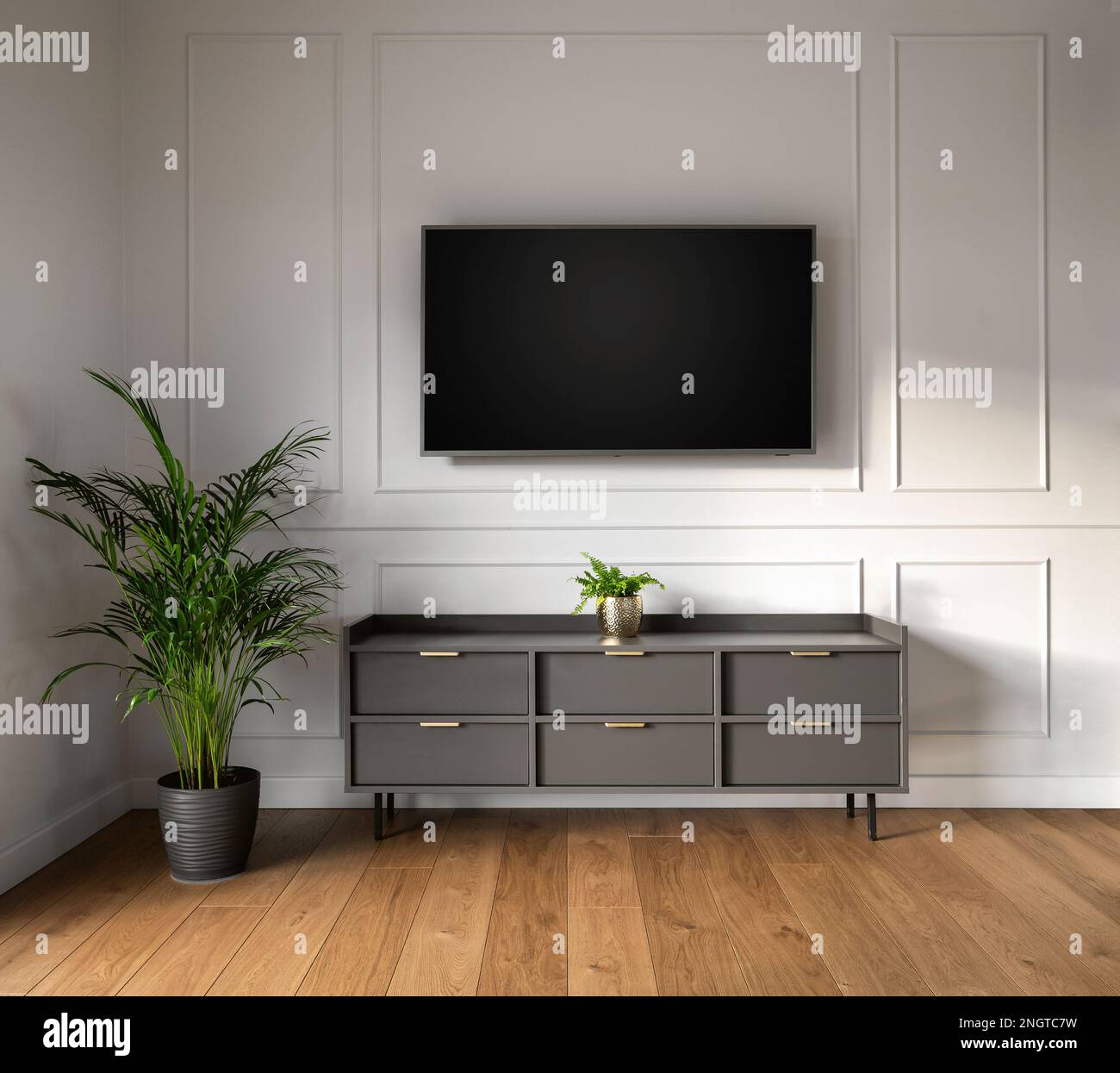 Empty room with blank TV hanging on the wall Stock Photo Alamy