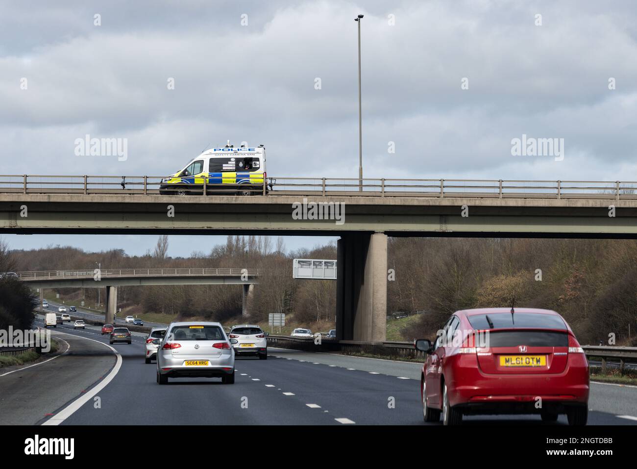 Police safety camera van on motorway bridge - England UK Stock Photo