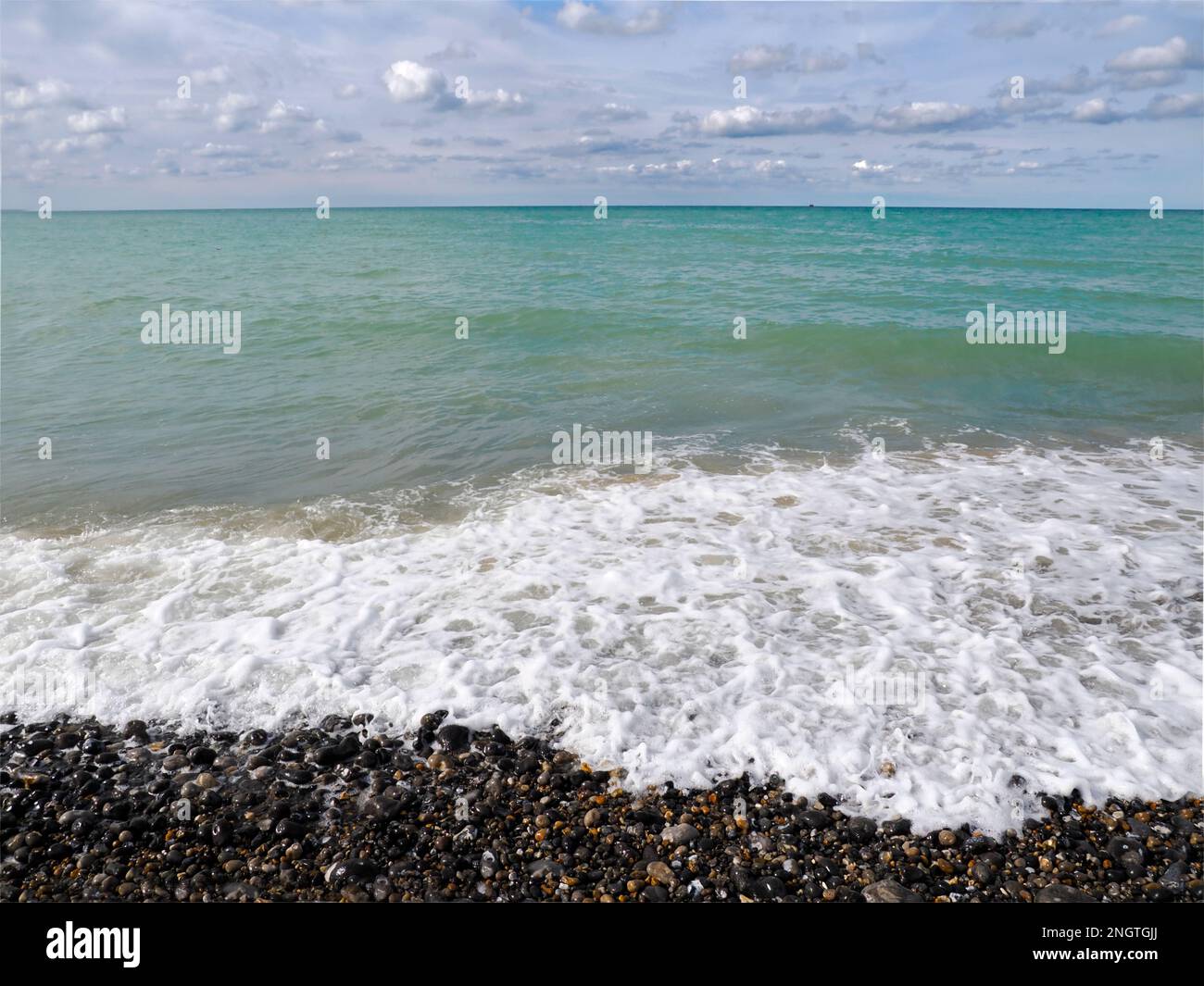 Sea and pebble beach at Le Treport, a commune in the Seine-Maritime department in Normandy, in northwestern France. Stock Photo
