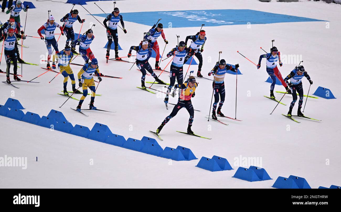 Oberhof, Germany. 19th Feb, 2023. Biathlon: World Championship, mass start 15 km, men. The biathletes start in the Lotto Thüringen Arena at Rennsteig. Credit: Martin Schutt/dpa/Alamy Live News Stock Photo