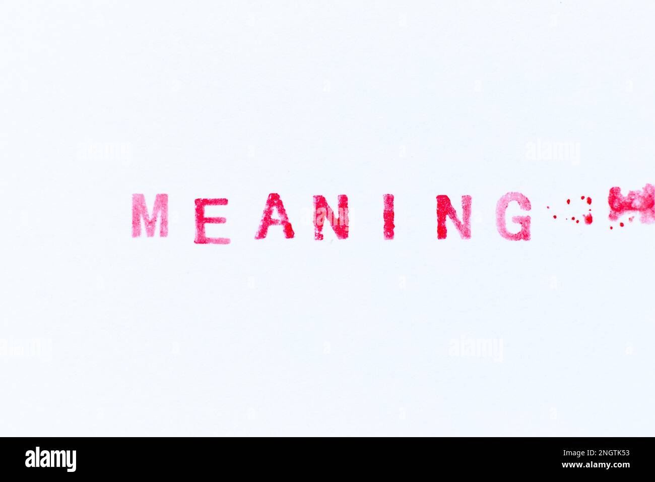 Red color ink rubber stamp in word meaning on white paper background