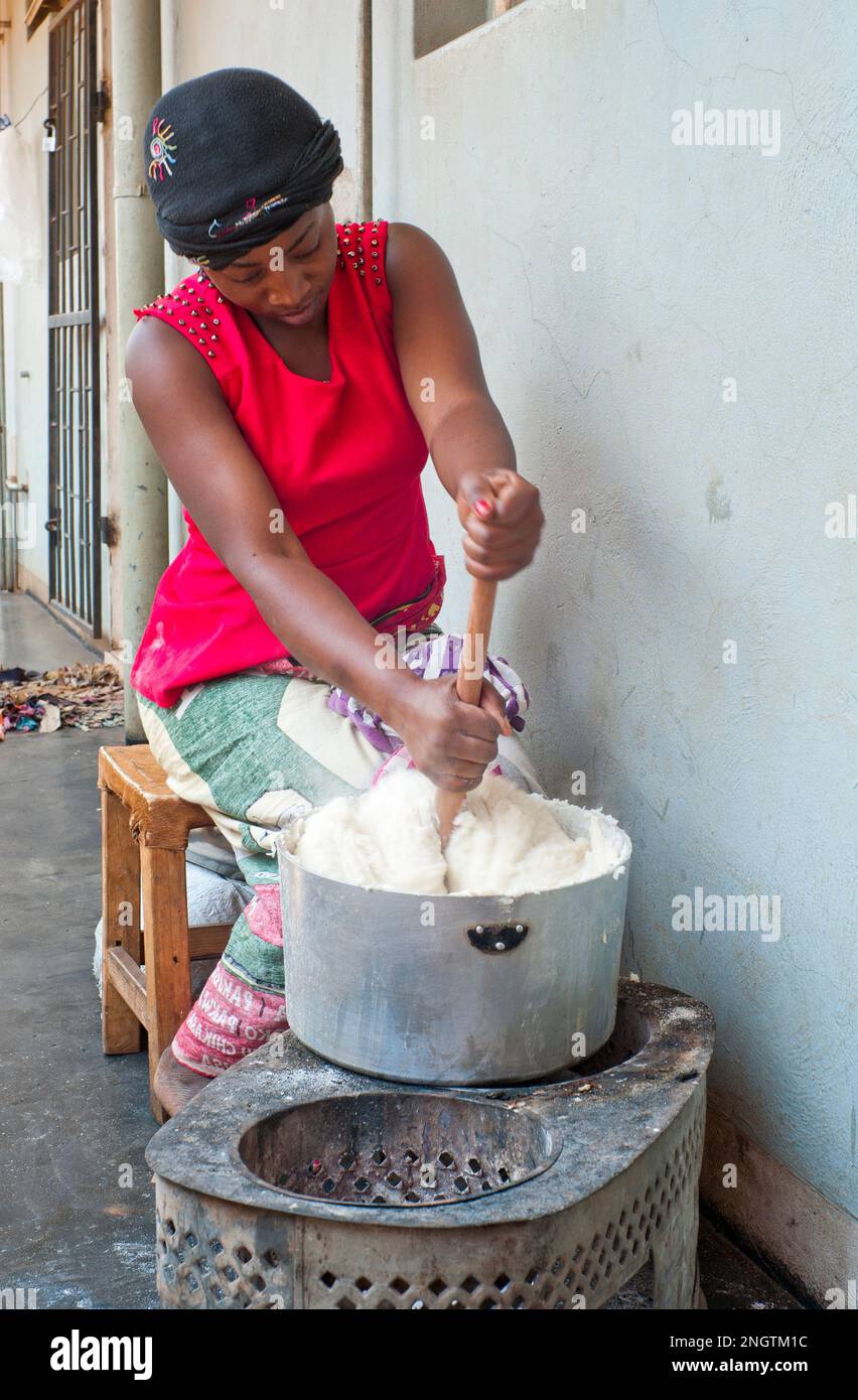 African woman cooking in a large pot, outside Stock Photo - Alamy