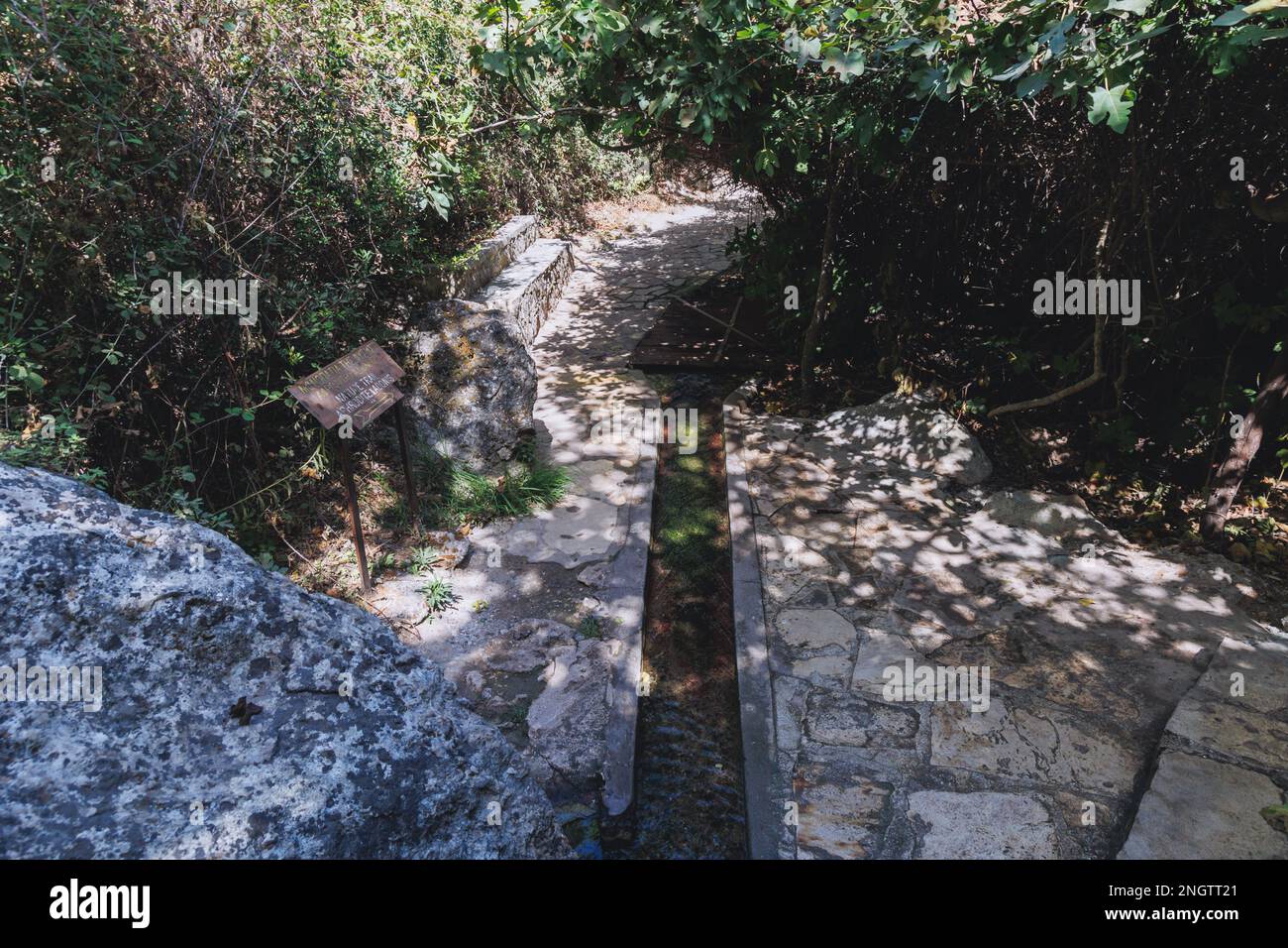 Path to Natural grotto of the Baths of Aphrodite Botanical Garden in