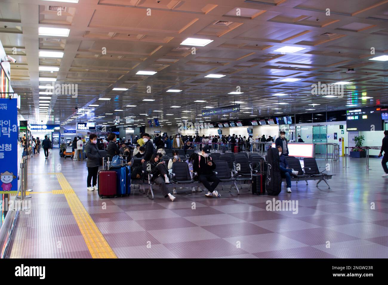 Korean people and foreign travelers passengers walking carry luggage