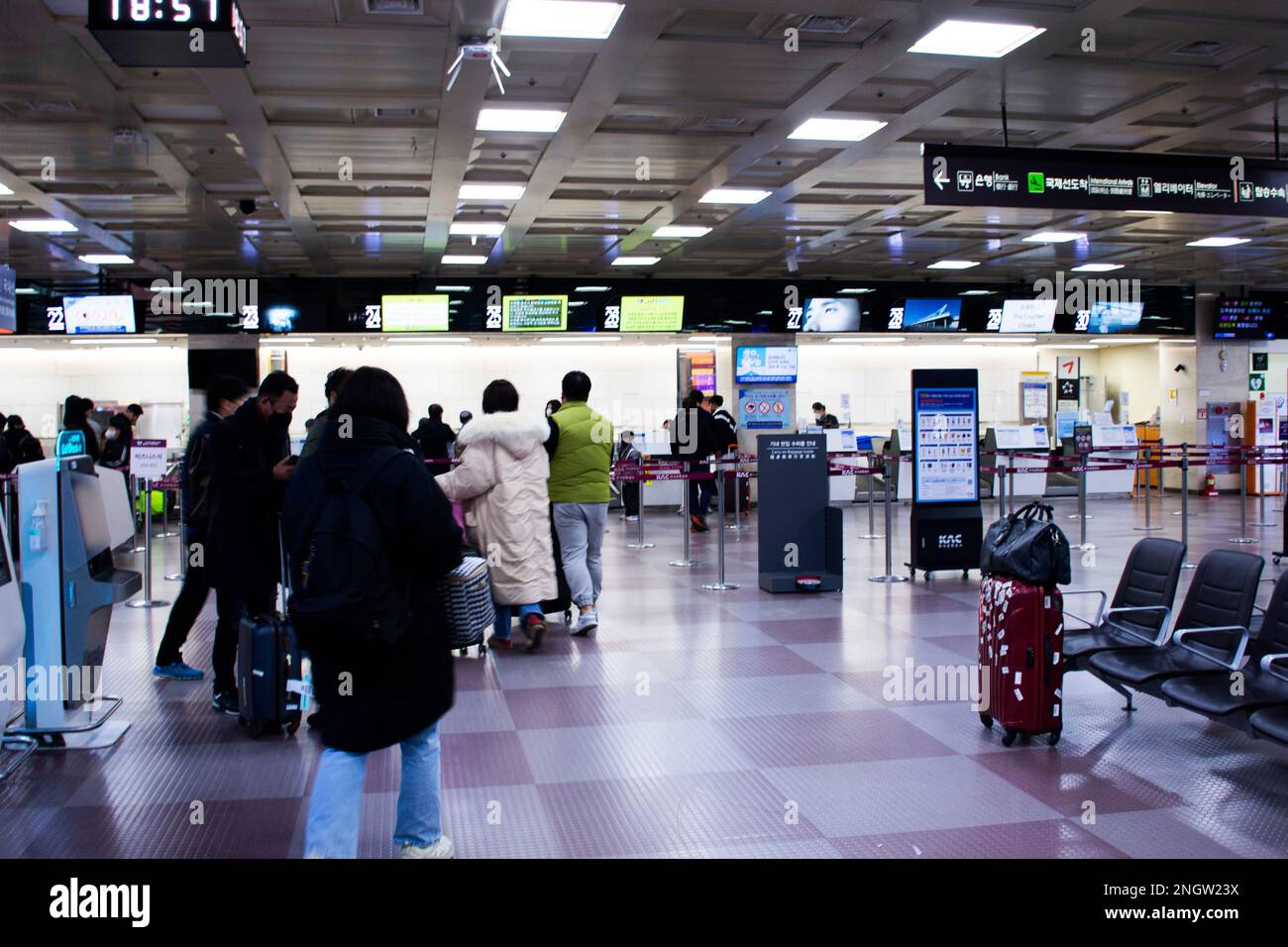 Korean people and foreign travelers passengers walking carry luggage